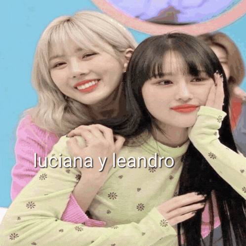 a picture of two girls with the words luciana y leandro written below them