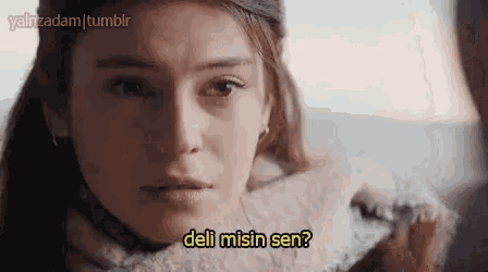 a close up of a woman 's face with a caption that says deli misin sen ?