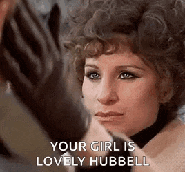 a close up of a woman 's face with the words `` your girl is lovely hubbell '' on it .