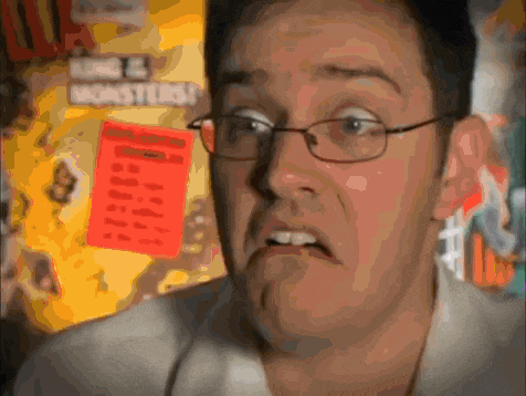 a blurry picture of a man with glasses in front of a sign that says long & mighty