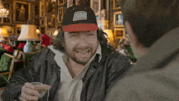 a man wearing a black hat that says cold chow on it