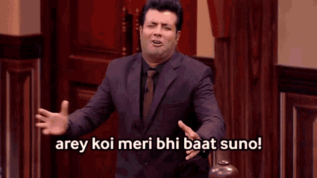 a man in a suit and tie says arey koi meri bhi baat suno