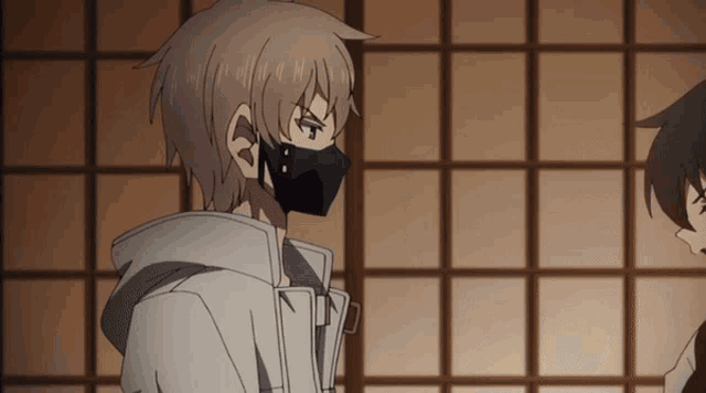 a boy with a mask on his face is looking at another boy