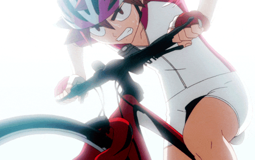 a person riding a bike with a helmet on