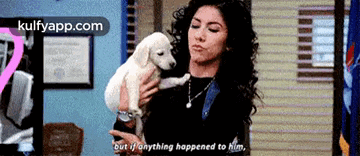 a woman is holding a puppy in her arms and says " but if anything happened to him "