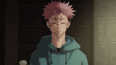 a man with pink hair and a beard is wearing a green hoodie .