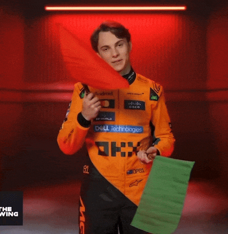a man wearing an orange shirt with dell technologies written on it