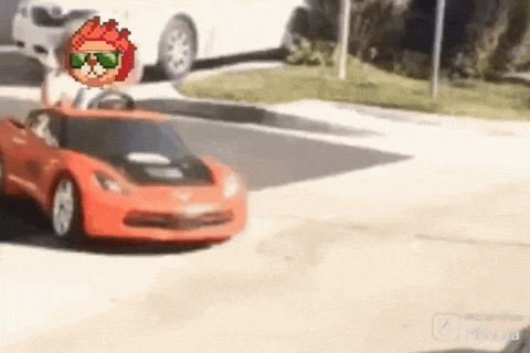 a toy car is driving down a street with a pixelated character behind it .