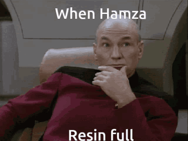a man is sitting in a chair with the words when hamza resin full