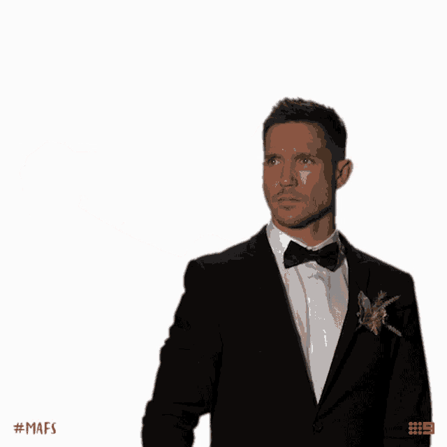 a man in a tuxedo is taking a selfie with the hashtag # mafs