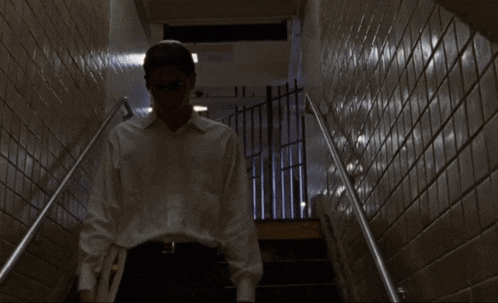 a blurry picture of a man walking up stairs