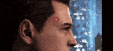 a close up of a man 's face with a red circle on it .