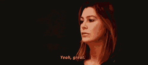 a woman is talking to someone in a dark room and saying `` yeah , great . ''