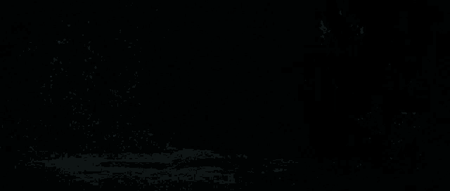 a close up of a car 's headlights and grille in the dark