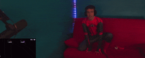 a blurred image of a person laying on a red bed
