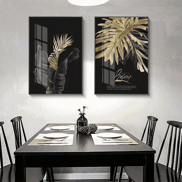 a dining room with a table and chairs and two paintings on the wall one of which says " beauty "