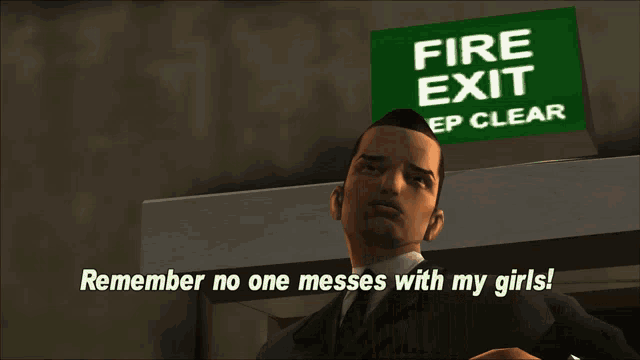 a man stands in front of a fire exit sign that says " remember no one messes with my girls "