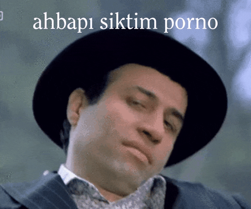 a man wearing a hat with the words ahbap1 siktim porno on the bottom right