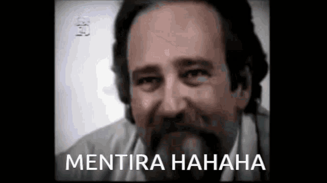 a close up of a man 's face with the words mentira hahaha on the bottom