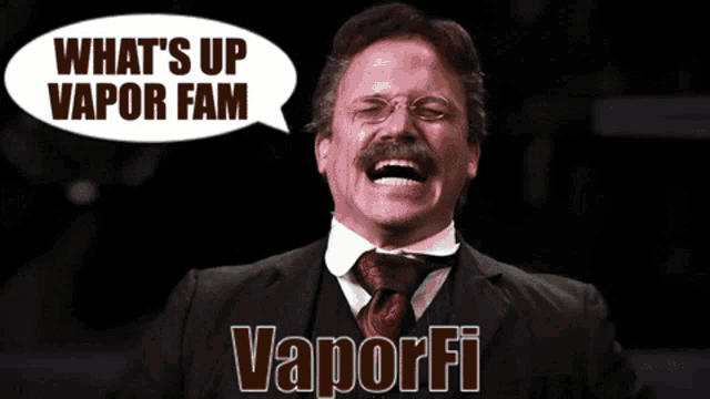 a man in a suit and tie laughs with a speech bubble saying what 's up vapor fam