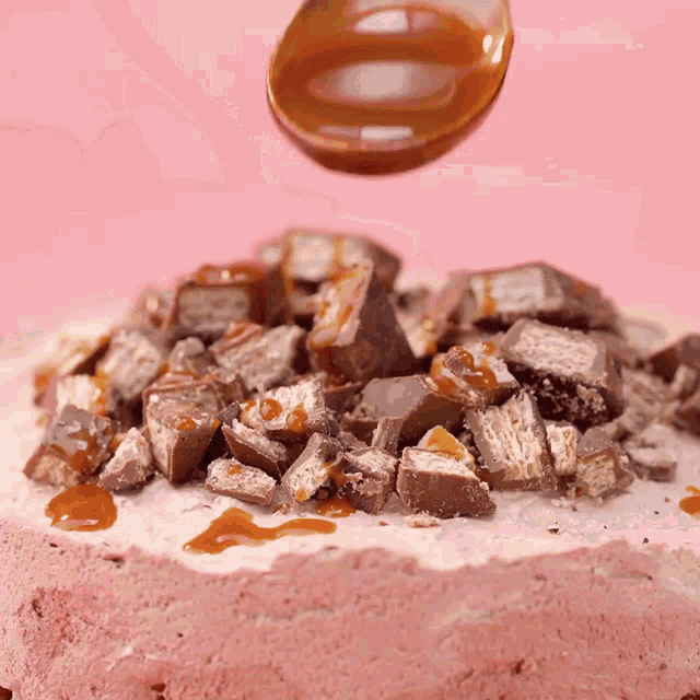 a cake with a lot of pieces of chocolate on it