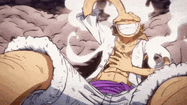 a man in a white shirt and purple pants is sitting on top of a giant .
