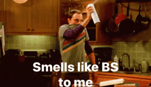 a man spraying something in a kitchen with the words smells like bs to me below him