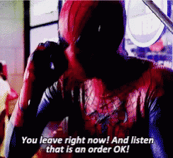 a man in a deadpool costume is talking on a cell phone