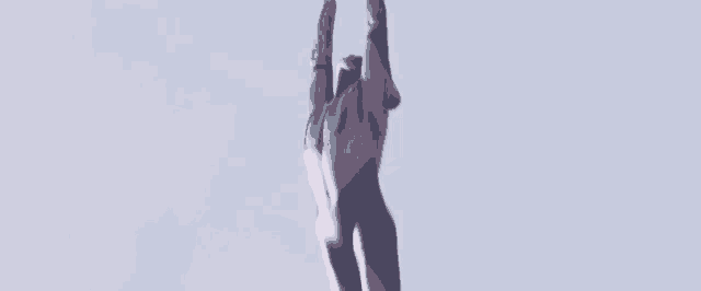 a person is flying through the air with a parachute on their back .