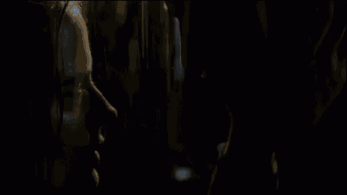 a man and a woman are looking at each other and touching their faces