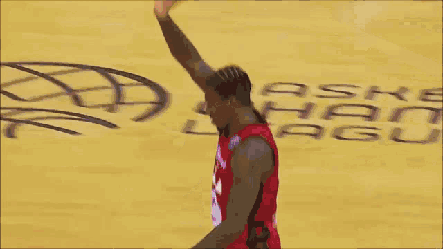 a basketball player wearing a red jersey with the number 31