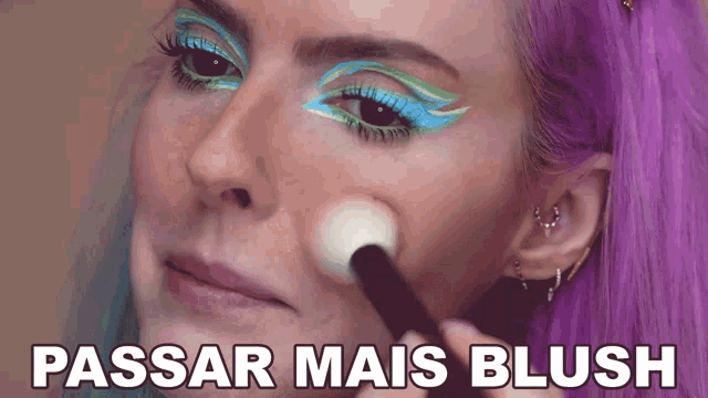 a woman with purple hair is applying makeup and the caption says passar mais blush