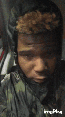 a close up of a person 's face with the words imgplay visible