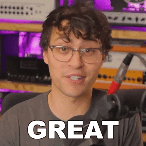 a man wearing glasses and headphones says great