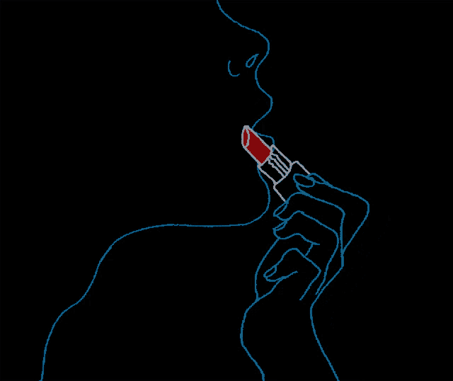 a woman is applying red lipstick on her lips