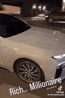 a white car with the words rich millionaire written on the side