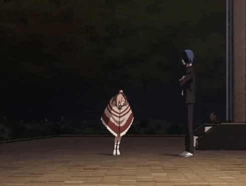 a man and a girl are standing on a brick walkway at night