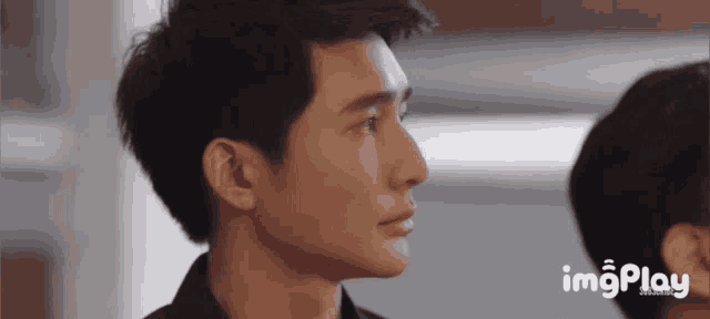 a close up of a man 's face with the words imgplay written on the bottom