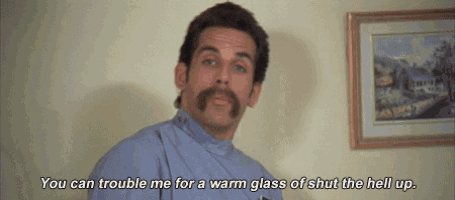 a man with a mustache is talking about a warm glass of shut the hell up