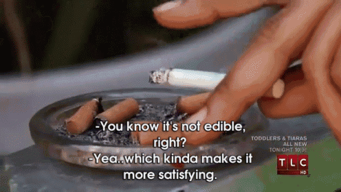 a person smoking a cigarette in an ashtray that says tlc hd