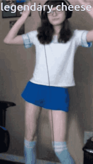 a girl wearing headphones and knee high socks is dancing with the words legendary cheese below her