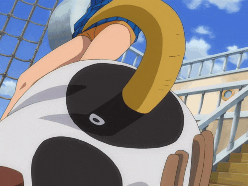 a cartoon drawing of a person sitting on a ball with a black and white circle with the letter o on it