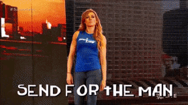 a woman standing in front of a screen that says send for the man