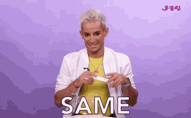 a man wearing a white jacket and a yellow shirt is saying same