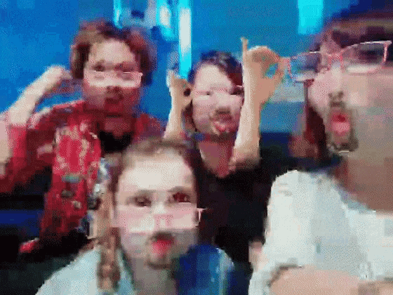 a group of people are making funny faces in a pixelated photo