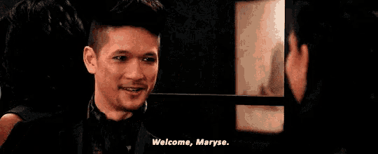 a man in a suit says welcome maryse