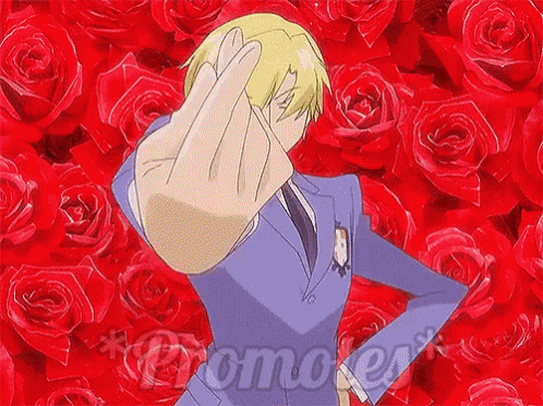 a man in a suit and tie is giving the middle finger in front of roses .