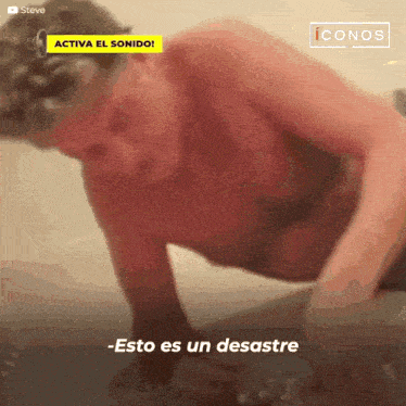 a shirtless man is doing push ups and says " esto es un desastre " in spanish