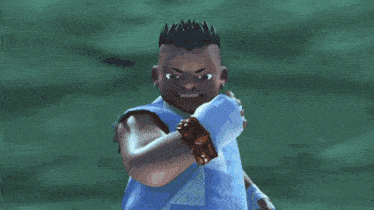 a man in a blue shirt is surrounded by water splashes