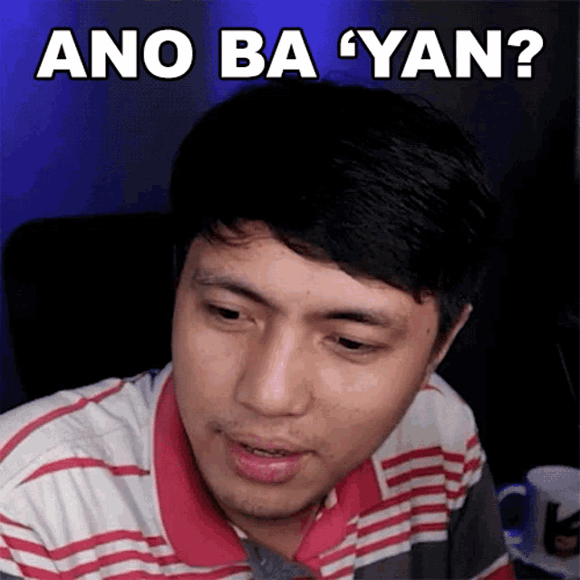 a man in a striped shirt is asking ano ba yan